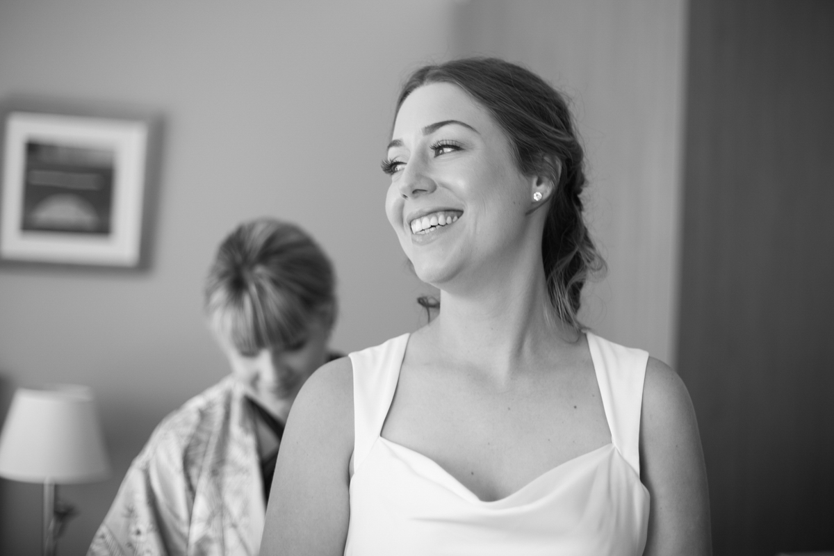 04_happy bride at crowne plaza newcastle with candid wedding photographer